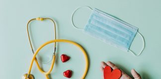 medical stethoscope and mask composed with red foiled chocolate hearts