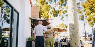 elderly couple walking on the street