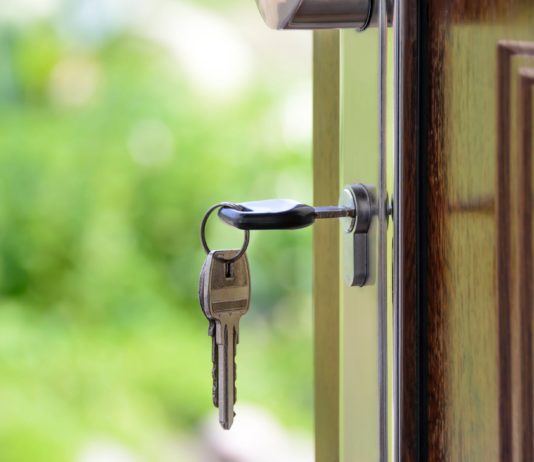 black handled key on key hole